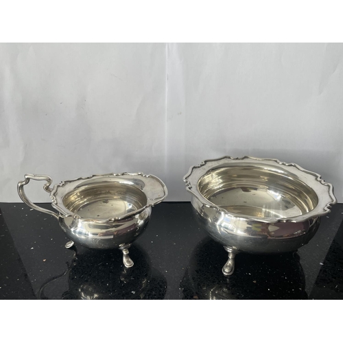 32A - TWO SILVER ITEMS TO INCLUDE A SUGAR BOWL AND CREAM JUG BOTH HALLMARKED SHEFFIELD 1911 GROSS WEIGHT 2... 