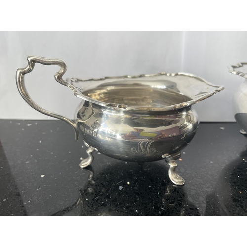 32A - TWO SILVER ITEMS TO INCLUDE A SUGAR BOWL AND CREAM JUG BOTH HALLMARKED SHEFFIELD 1911 GROSS WEIGHT 2... 