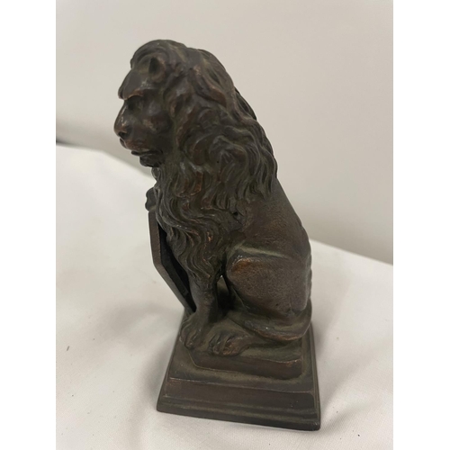 60a - A SMALL BRONZE STATUE OF A LION