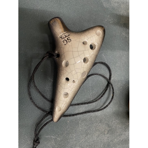 144 - A BOXED MOUTH FLUTE