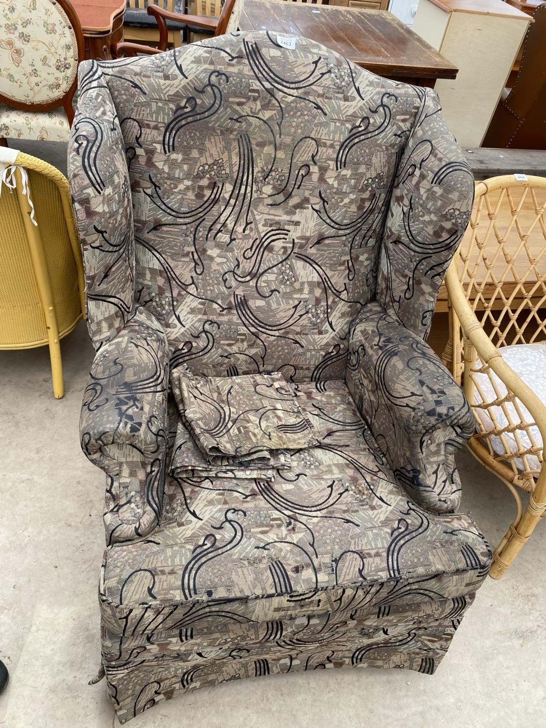 A PARKER KNOLL WINGED EASY CHAIR WITH ANTIMACASSARS