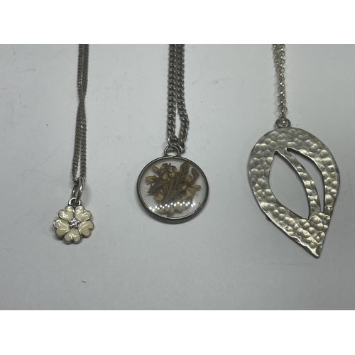 557 - THREE MARKED SILVER NECKLACES WITH PENDANTS