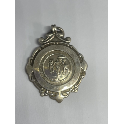 583 - A HALLMARKED BIRMINGHAM SILVER FOOTBALL MEDAL 1946 - 1947