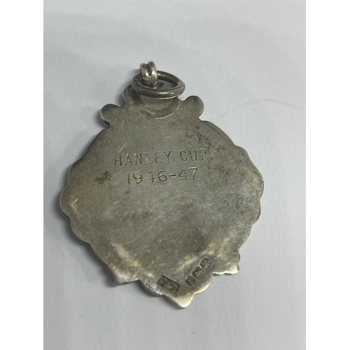 583 - A HALLMARKED BIRMINGHAM SILVER FOOTBALL MEDAL 1946 - 1947