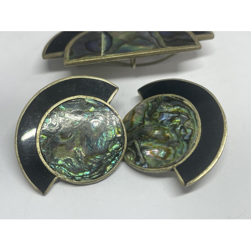 598 - A MARKED SILVER AND MOTHER OF PEARL BROOCH WITH MATCHING CLIP ON EARRINGS