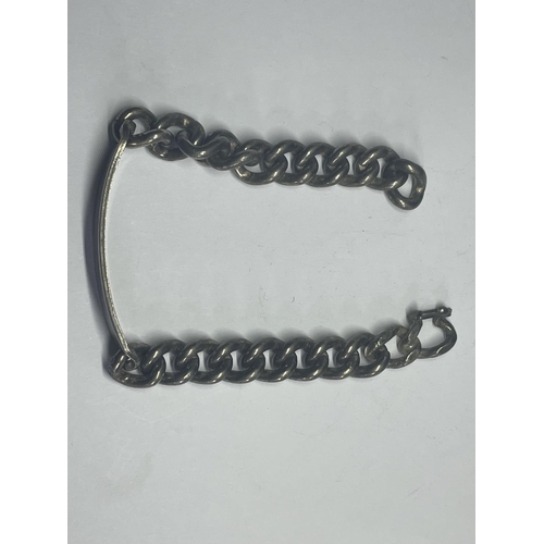 621 - A HEAVY SILVER IDENTITY BRACELET