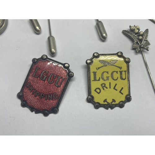 627 - SIX PIN BADGES AND TWO LGCU PENDANTS