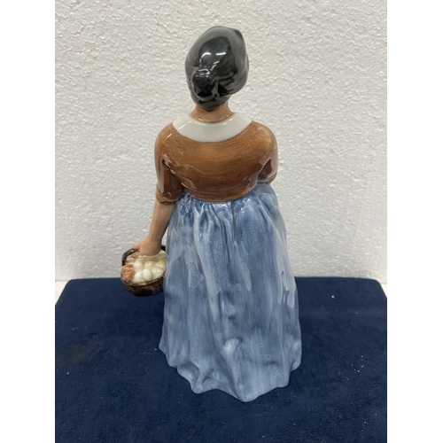 395 - A ROYAL DOULTON FIGURE FARMER'S WIFE HN 3164