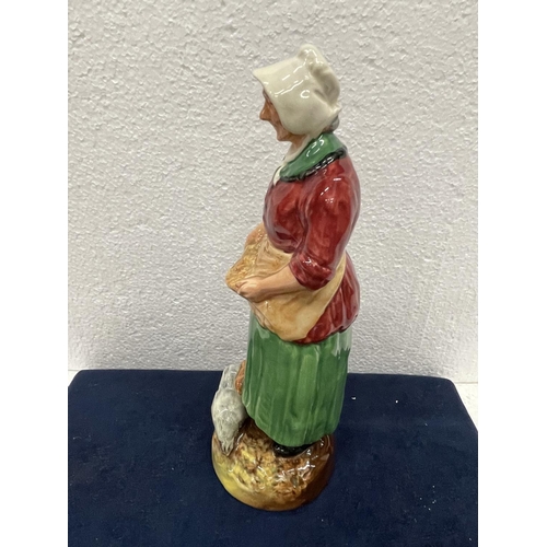 396 - A ROYAL DOULTON FIGURE THE FARMERS WIFE  HN 2069