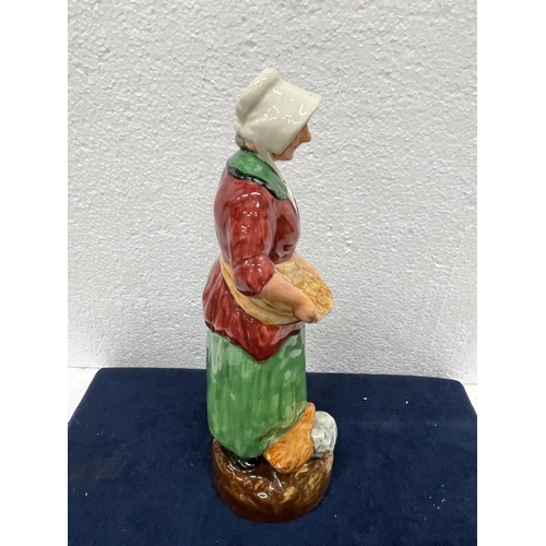 396 - A ROYAL DOULTON FIGURE THE FARMERS WIFE  HN 2069