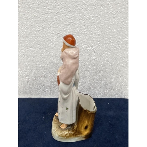 411 - A VINTAGE CONTINENTAL CERAMIC OF A MOTHER AND CHILD WITH MATCH HOLDER AND STRIKER