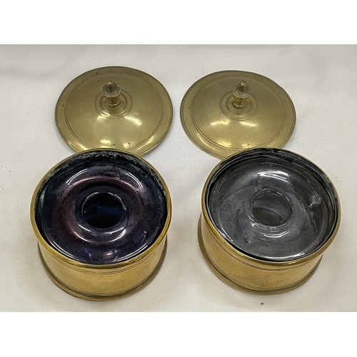 11 - TWO VINTAGE BRASS INKWELLS WITH GLASS LINERS