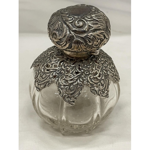 25 - A HALLMARKED SILVER DECORATIVE PERFUME BOTTLE WITH STOPPER