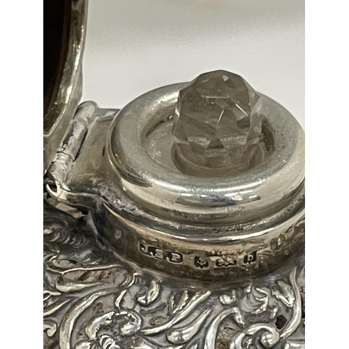 25 - A HALLMARKED SILVER DECORATIVE PERFUME BOTTLE WITH STOPPER