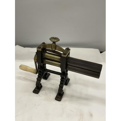 32 - A VICTORIAN BRASS AND CAST CRIMPING MACHINE FOR PLEATING AND RUFFLING LAUNDERED AND STARCHED CUFFS A... 