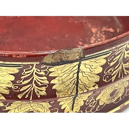 36 - A BELIEVED ENGLISH REGENCY CIRCA 19TH CENTURY WINE COASTERS IN CINNABAR RED LACQUER AND GILDED DESIG... 