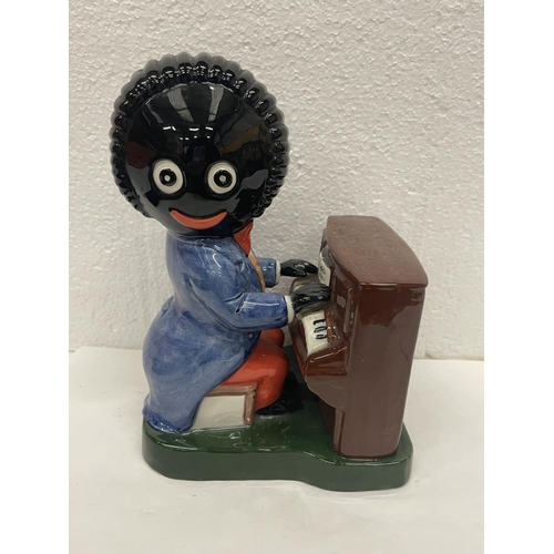 431 - A LIMITED EDITION CARLTON WARE HAND PAINTED FIGURE OF THE PIANO PLAYER 686/1250