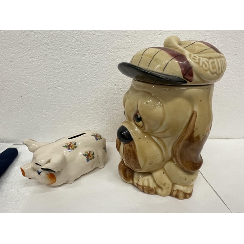 452 - TWO PRICE BROTHERS ITEMS TO INCLUDE A DOG BISCUIT BARREL AND A PIG MONEY BOX