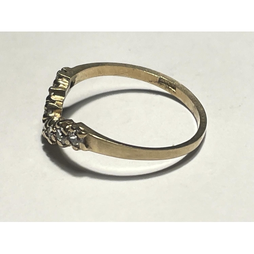 516 - A 9 CARAT GOLD WISHBONE RING WITH CUBIC ZIRCONIAS SIZE L