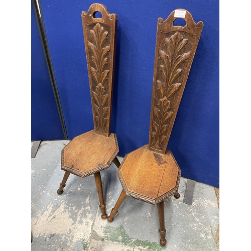 60A - A PAIR OF CARVED OAK SPINNING CHAIRS