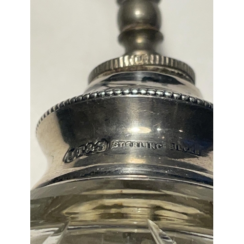 654 - A VINTAGE CUT GLASS PERFUME BOTTLE WITH A STERLING SILVER TOP