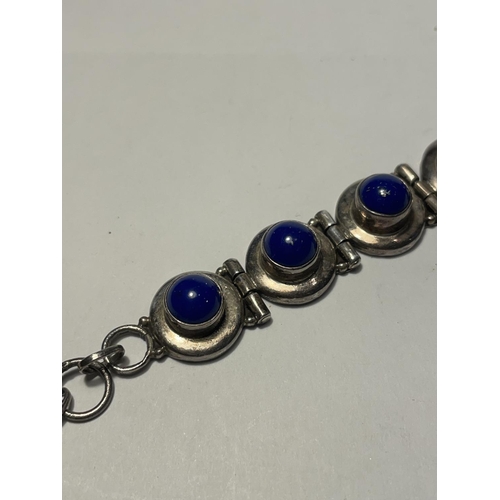 661 - A SILVER BRACELET WITH BLUE STONES IN A PRESENTATION BOX