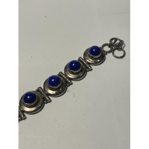 661 - A SILVER BRACELET WITH BLUE STONES IN A PRESENTATION BOX