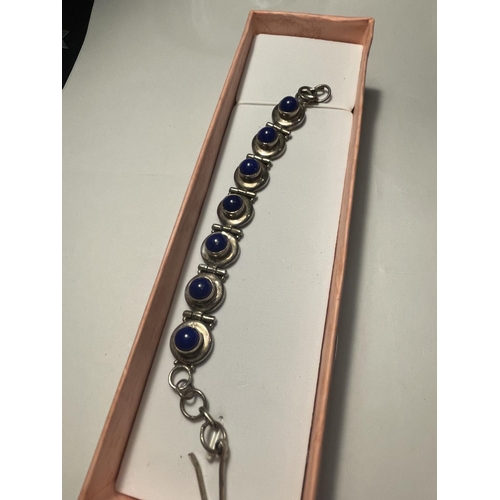 661 - A SILVER BRACELET WITH BLUE STONES IN A PRESENTATION BOX