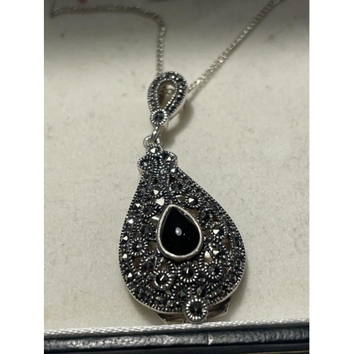 663 - A SILVER NECKLACE WITH A MARCASITE DROP PENDANT IN A PRESENTATION BOX