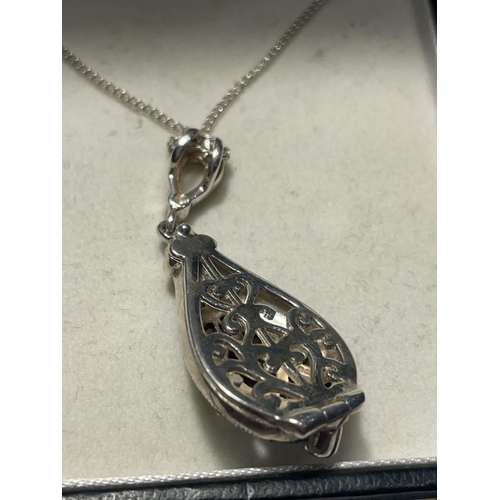 663 - A SILVER NECKLACE WITH A MARCASITE DROP PENDANT IN A PRESENTATION BOX