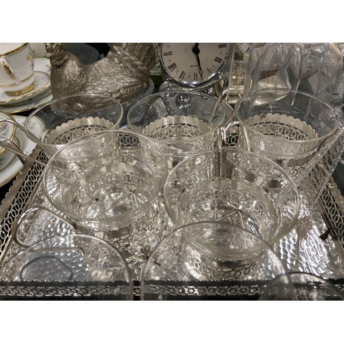 134 - A LARGE QUANTITY OF GLASSWARE TO INCLUDE GLASSES, CLOCKS, SHIPS, ANIMALS, BELLS, ETC