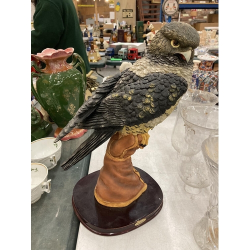 169 - A JULIANA COLLECTION RESIN FIGURE OF A KESTREL ON A WOODEN PLINTH 49CM HIGH