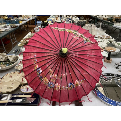 180 - TWO LARGE HANDPAINTED EASTERN FANS AND A HANDPAINTED PARASOL