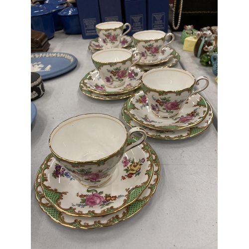 214 - FIVE AYNSLEY CHINA TRIOS WITH A FLORAL PATTERN