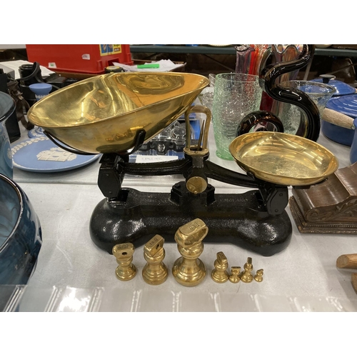 218 - A SET OF VINTAGE LIBRA CAST AND BRASS SCALES WITH WEIGHTS