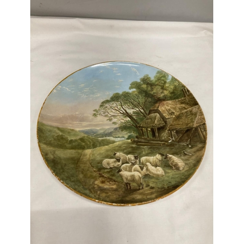 220 - A COALPORT CHARGER WITH AN IMAGE OF GRAZING SHEEP DIAMETER 31.5 CM