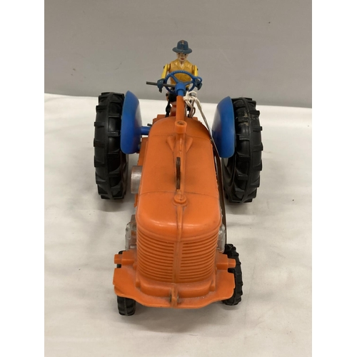 226 - A BATTERY POWERED PLASTIC MODEL OF A VINTAGE TRACTOR