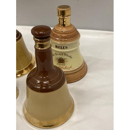 231 - FOUR VINTAGE CERAMIC BELL'S WHISKY BELL SHAPED DECANTERS