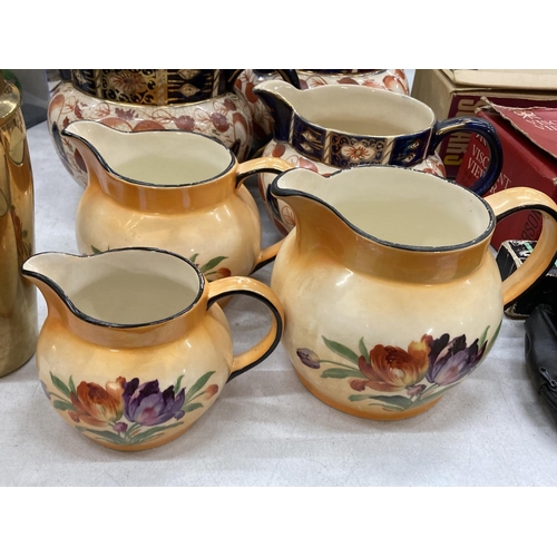 239 - A QUANTITY OF JUGS TO INCLUDE A GRADUATED SET OF THREE ARTHUR WOOD PLUS ANOTHER GRADUATED SET WITH A... 