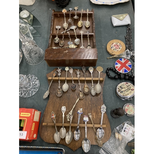 251 - TWO TEASPOON RACKS CONTAINING A QUANTITY OF COLLECTABLE TEASPOONS