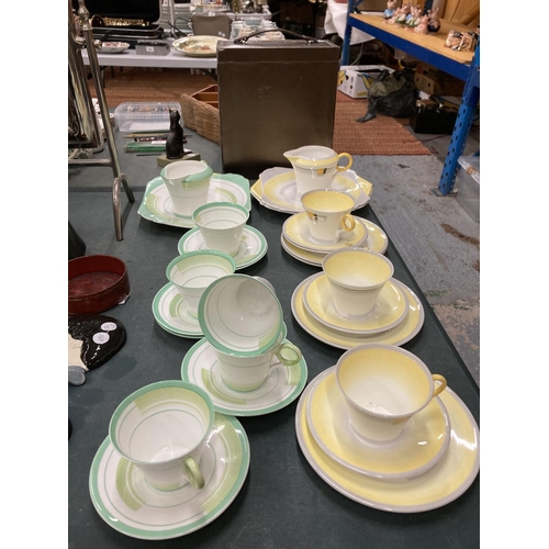 61 - TWO ART DECO SHELLEY PART TEASETS - YELLOW AND GREEN - TO INCLUDE CAKE PLATES, CUPS, SAUCERS, SIDE P... 