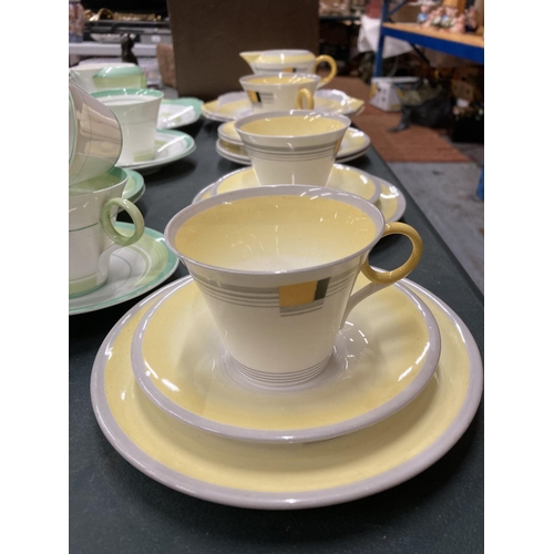 61 - TWO ART DECO SHELLEY PART TEASETS - YELLOW AND GREEN - TO INCLUDE CAKE PLATES, CUPS, SAUCERS, SIDE P... 