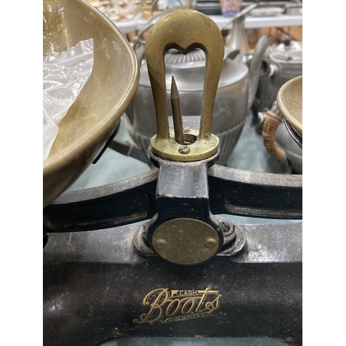 74 - A SET OF VINTAGE 'BOOTS' CAST SCALES WITH BRASS PAN AND WEIGHTS