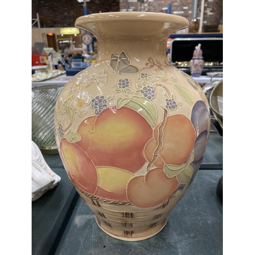 78 - A LARGE PEACH COLOURED VASE WITH FLORAL DECORATION HEIGHT 30CM