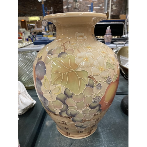 78 - A LARGE PEACH COLOURED VASE WITH FLORAL DECORATION HEIGHT 30CM