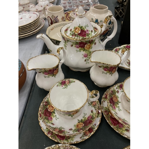 85 - A ROYAL ALBERT 'OLD COUNTRY ROSES' TEASET TO INCLUDE A TEAPOT, CREAM JUGS, SUGAR BOWL, CUPS, SAUCERS... 