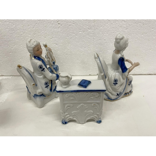 487 - THREE PORCELAIN MUSICAL SCENE FIGURES COMPRISING OF A GENT PLAYING THE VIOLIN AND A LADY PLAYING THE... 