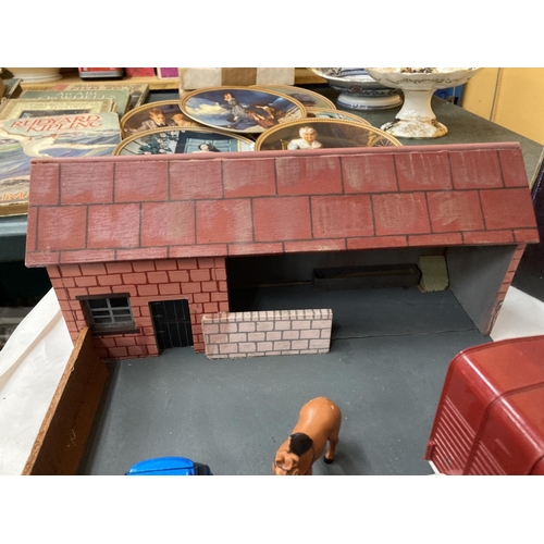 269 - A MODEL OF A FARMHOUSE AND STABLE BLOCK WITH A LANDROVER AND HORSEBOX AND A CAR AND CARAVAN