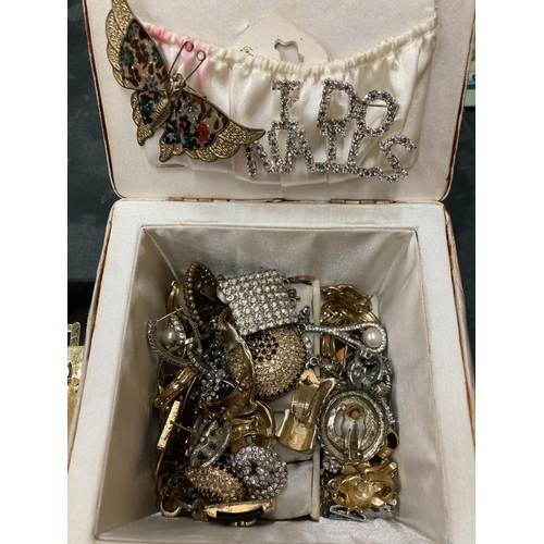 279 - A QUANTITY OF COSTUME JEWELLERY TO INCLUDE CLIP-ON AND PIERCED EARRINGS, BROOCHES, ETC PLUS SIX UGG,... 