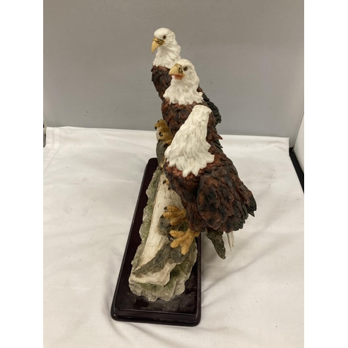 296 - A RESIN MODEL OF A GROUP OF THREE BALD EAGLES ON A BRANCH BY THE JULIANA COLLECTION HEIGHT 29CM, WID... 